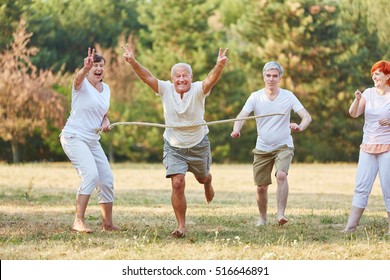 Happy seniors winning the running race in the park - Powered by Shutterstock