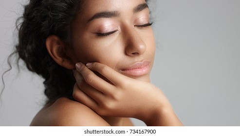 Happy Serene Young Woman With Beautiful Olive Skin And Curly Hair Ideal Skin And Brown Eyes