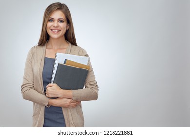 Happy shcool teacher holding books. Isolated professional portrait. - Powered by Shutterstock