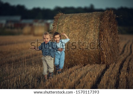 Similar – Vater und Sohn sitzen im Park.