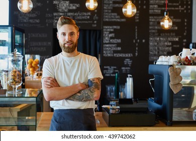 Happy Small Business Owner Standing At Coffee Shop