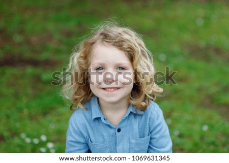 Similar – Small child with long blond hair enjoying of a sunny day