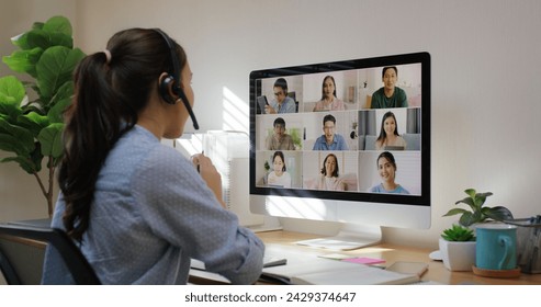 Happy smile asia young talent woman learn mba college class on webcam video call in desktop screen with cowork friend workforce group talk in sale report. Smart job work at home for staff workspace. - Powered by Shutterstock