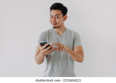 Happy Smile Face Asian Man Who Found A Better Application In His Mobile.