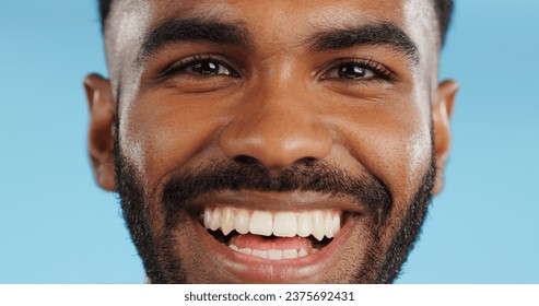 Happy, smile and face of black man in studio, blue background and mockup space with happiness or advertising. Portrait, closeup and marketing for skincare, wellness or healthy dermatology care - Powered by Shutterstock