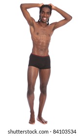 Happy smile to go with fit healthy toned body of handsome young African American man wearing black underwear only, standing showing off slim torso and abdominal muscles.