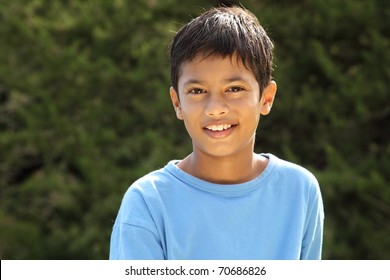 Happy smile from young boy in countryside sunshine