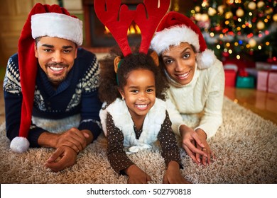 Happy Smiling African American Family In Christmas Atmosphere