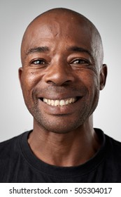 Happy Smiling African Black Man Portrait Of Real Person In Studio. Full Collection Of Diverse Faces In This Set.