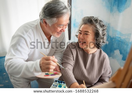 Similar – Image, Stock Photo Elderly woman painter holding a brush in art studio