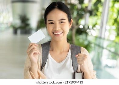 Happy Smiling Asian Female Student Holding Blank Credit Card, Concept Of Student Card, Student Loan, Scholarship Money, Educational Financial Credit