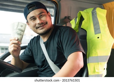 Happy Smiling Asian Men Truck Driver Holding Banknote US Dollar. Laugh Mature Man With Beard Owner, Business, Transportation,  Delivery Cheerful Paid Cargo And Service From Customers Confident Trust.