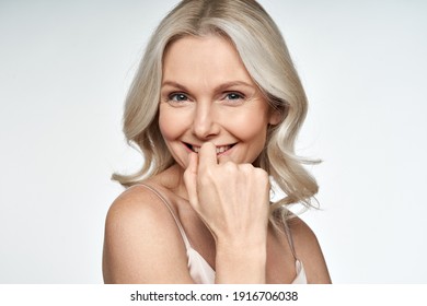 Happy Smiling Attractive 50s Middle Aged Blonde Woman Looking At Camera Advertising Antiage Face Skin And Aging Hair Care Treatment And Cosmetics Isolated On White Background. Close Up Portrait.