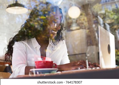 Happy, Smiling Beautiful African American Woman In Prescription Glasses, Business Startup Freelancer Or Designer Works On Laptop In Coworking Hub, Empowered Female With Technology