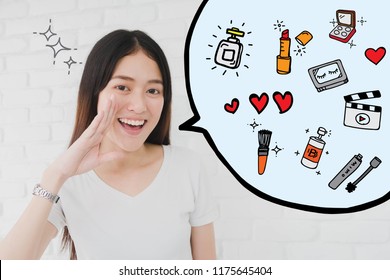 Happy smiling beautiful Asian woman gesturing with hand to telling beauty vlog and blogger with cosmetics illustrator doodles background.Beauty and cosmetic online influencer on social media concept.