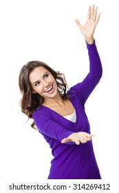 Happy Smiling Beautiful Young Woman Carring, Holding Or Showing Something Transparent Or Visual Imaginary, In Violet Casual Clothing, Isolated Over White Background