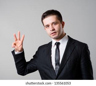 Happy Smiling Business Man Showing Three  Fingers