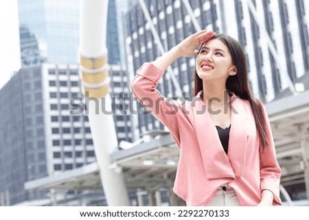 Happy smiling business woman standing outdoor looking high not fear hot UV sunlight from high protection sunscreen skin care