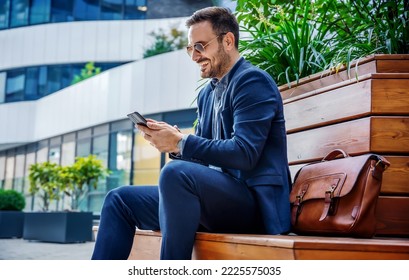 Happy smiling businessman making video call with his client on smartphone. Business, lifestyle concept - Shutterstock ID 2225575035