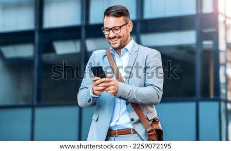 Happy smiling businessman making video call with his client on smartphone. Business, lifestyle concept