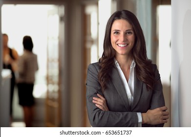 Happy smiling ceo manager at office space, possibly real estate, lawyer, non-profit, marketing