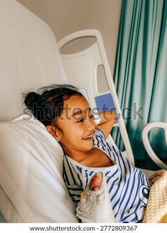 Happy smiling child while being admitted to the hospital. Funny kid