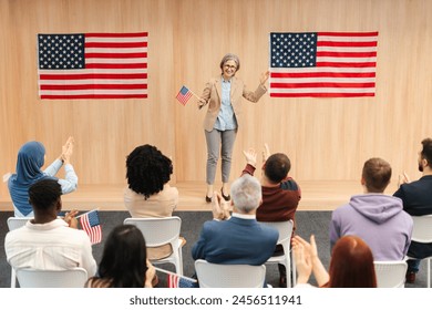 Happy, smiling confident woman, politician, presidential candidate holding American flag communication, speaking with audience. Vote, United States presidential election concept - Powered by Shutterstock