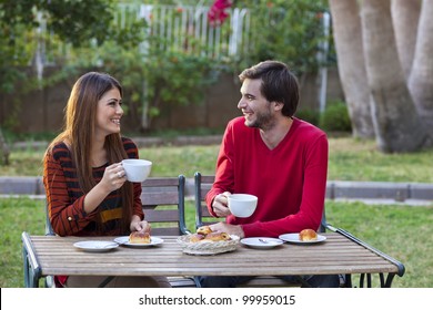 Happy smiling couple having lunch in garden - Powered by Shutterstock