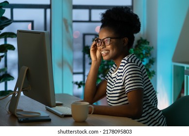 Happy Smiling Designer Girl Enjoy Working From Home On New Remote Project. Successful African Web Developer Coding New Program, Website Or Software. Young Freelance Black Woman On Distance Occupation