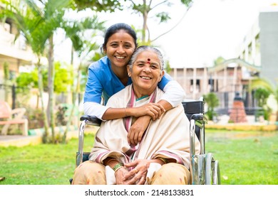 happy smiling doctor embracing or hugging recovered patient on wheelchair at hospital park by looking at camera - concept of professional occupation, empathy, and compassion. - Powered by Shutterstock