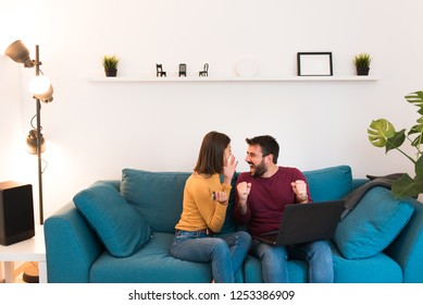 Happy smiling excited beautiful couple online shopping from home from computer. Christmas online shopping with internet credit card.  - Shutterstock ID 1253386909