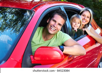 Happy Smiling Family And A Family Car.