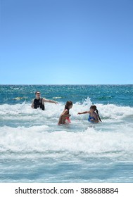 Happy smiling family having fun in the beautiful ocean, Boca Raton, Florida.
