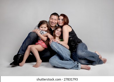 Happy Smiling Family Portrait of Husband Wife and 2 Daughters