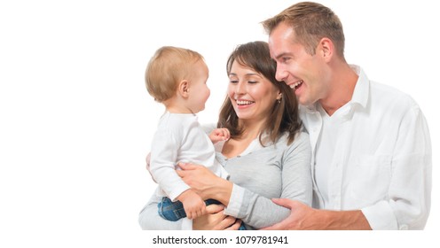 Happy Smiling Family Portrait Isolated On White Background. Father And Mother With Little Baby Laughing Together. Mom, Dad And Their Child. Parents And Child, Healthy White Teeth. Parenthood Concept