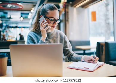 Happy Smiling Female Journalist Planning Meeting While Talking About Interview Via Application On Mobile Phone And Enjoying Distance Job, Successful Programmer Calling To Customer Service Indoors