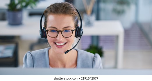 Happy, Smiling And Friendly Call Center Agent Or Telemarketing Operator Wearing Headset While Working In An Office. Smile Of A Sales Consultant Operating Helpdesk For Customer And Service Support