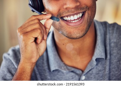 . Happy, Smiling And Friendly Call Center Agent Wearing Headset While Working In An Office. Closeup Smile Of A Confident Man Consulting And Operating Helpdesk For Customer Sales And Service Support.