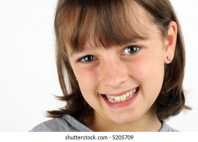 Happy, smiling girl against a white background