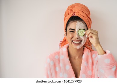 Happy smiling girl applying facial organic cream - Healthy beauty treatment and self care lifestyle concept - Powered by Shutterstock