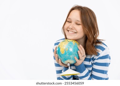 A Happy Smiling Girl is Enthusiastically Holding a Globe, Dressed in a Blue Striped Sweater - Powered by Shutterstock