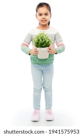 Happy Smiling Girl Holding Flower In Pot