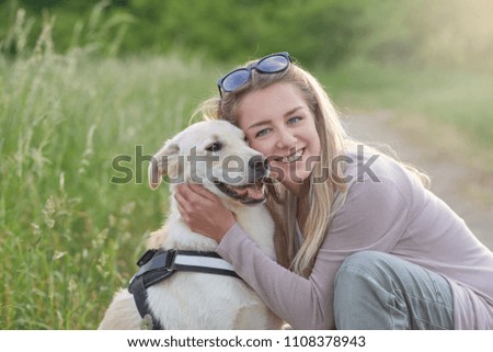 Similar – Foto Bild Glücklicher lächelnder Hund mit seinem hübschen jungen Besitzer