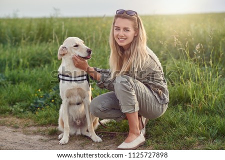 Similar – Foto Bild Glücklicher lächelnder Hund mit seinem hübschen jungen Besitzer