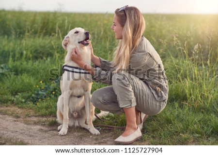 Similar – Foto Bild Glücklicher lächelnder Hund mit seinem hübschen jungen Besitzer