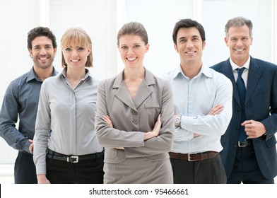 Happy Smiling Group Of Business People Standing Together At Office