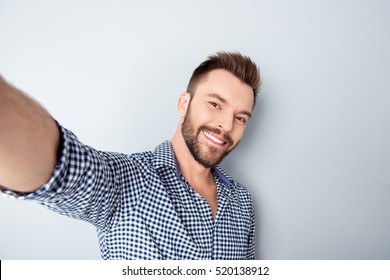 Happy Smiling Handsome Bearded Young Man Making Selfie.