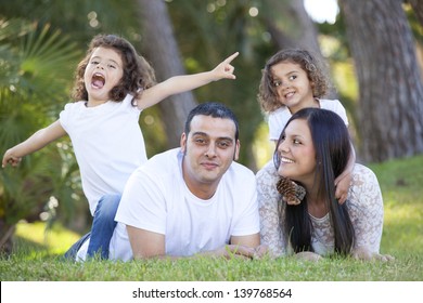 Happy Smiling Hispanic Family Parents And Children