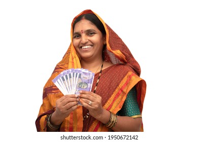 Happy Smiling Indian Woman Holding Indian Money Or Currency Notes On Isolated Background - Concept Of Woman Empowerment, Earnings, Bank Loan And Business.