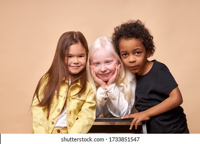 Happy Smiling Kids Isolated In Studio, Albino,afro American And European Children Laugh, Smile At Camera, Wearing Bright Clothes. Children Diversity, Kindness, Tolerance Concept